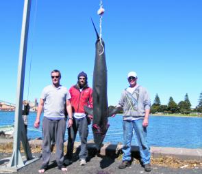 Local anglers Bruce McPherson, Darren Bennet and Dan Bishop with their massive mako weighing 92.8kg.