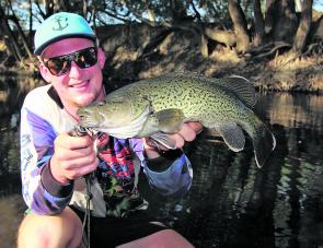 Brenton Richardson with a perfect specimen of a protected trout cod caught in the Ovens River system recently. The fish was released unharmed. 