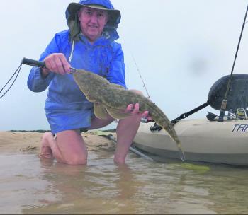 Putting up with cold, wet conditions paid off in this instance, with a quality flathead making it all worthwhile.