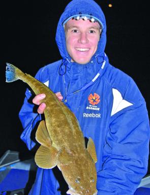 Matt Mundy with one of several good table sized flathead landed on soft plastics.