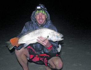 Daniel Sloan with a squid caught school jewfish from the beach.