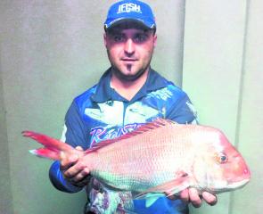 Ned Dragojevic proudly displays a 2.8kg snapper taken on a fresh salmon head, 18m out from Mornington.