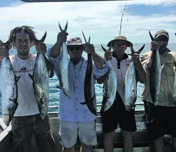 A happy crew bagged out on spotted mackerel.