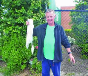 Wonthaggi angler Peter Clarks with a very large squid caught on the run-in tide.