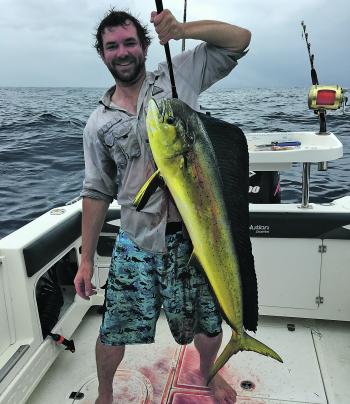 Damo Monerhan with a nice size mahimahi caught from a floating pallet north of the banks.