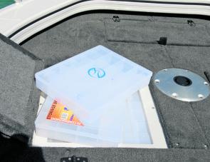 A nest of tackle trays dwells in the port storage compartment, in easy reach of the angler on the casting deck. 