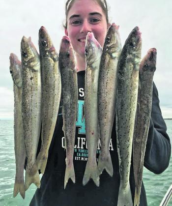 Another Think Big Client with her hands full of Western Port spotted bones. Photo courtesy of Think Big Charters.