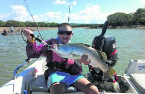 Brendan Reed with his first keeper barra caught at Coorooman Creek.