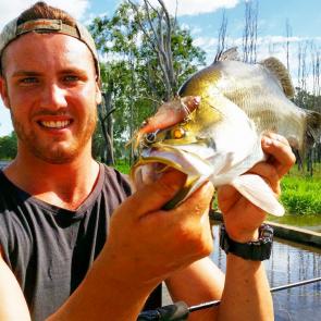 CQ Fishing and Boating Facebook team member Trent with an awesome Woolwash run-off barra.