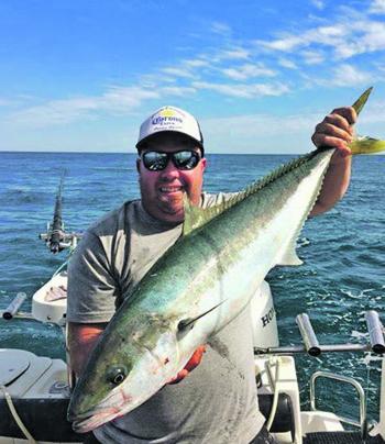 Baz Gorman with a fine example of the yellowtail kingfish on offer at the moment on the peninsula.