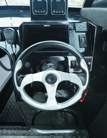 Want all the options? The Yellowfin’s dash can hold them. Note the engine gauge mounting box above the flush mounted 12” Simrad. Even the steering wheel looks schmick.