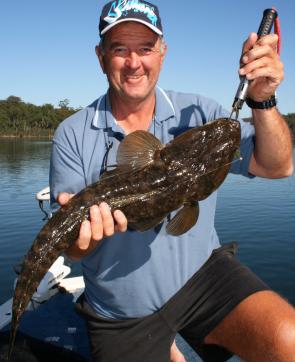 Gary Smith holds a 68cm flattie just prior to release.
