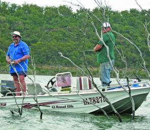 Anglers bob live yabbies for bass and yellowbelly right in the middle of a huge snag.