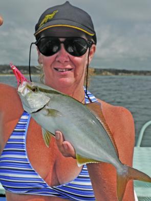 Jan Redman holds a warm-water visitor, an almaco jack, caught in Bermagui Bay.