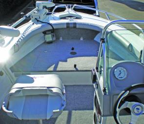 The serious fishing end of the Top Ender features upholstered coamings, a spacious casting platform, forward sounder and Minn Kota electric, with livewell and storage below decks. 