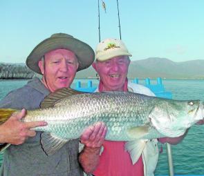 Former world boxing champ Barry Michael with the 94cm fish caught by his dad, Lenny.