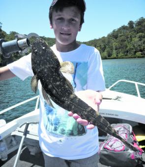 Thomas quickly got the hang of using soft plastics and put a few runs on the board, including this great flathead from a weedy drop-off in Cowan Creek.