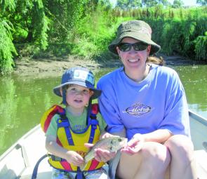 Beth and son Jett from Morpeth, near Maitland, with Jett’s first bass. The little specimen was caught on a locally made Marz botfly in black.