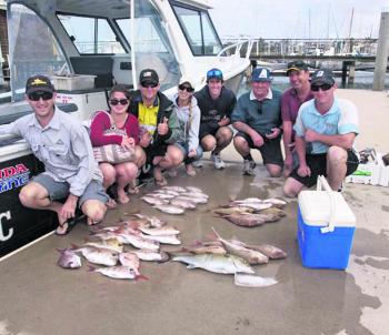 A happy group of anglers with their bag of snapper and a school-sized amberjack. 