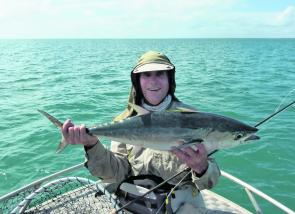 Long tail tuna, like the one the author is holding, are challenging fly rod opponents.