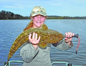 Felicia Downey with a beautiful 70cm flathead from Wapengo Lake, near Tathra.