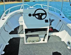 There’s plenty of room in and on the fold-down console and the hydraulic helm makes handling a breeze.
