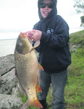 Nathan Angee with a massive Lake Burrumbeet European carp – there is a comp on the last Sunday of the month to help clear this water of as many carp as possible. Photo courtesy Steve Angee.