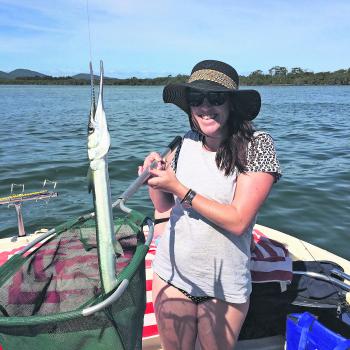 Elyse Holmes with the Long tom that was caught while fishing at Foster.