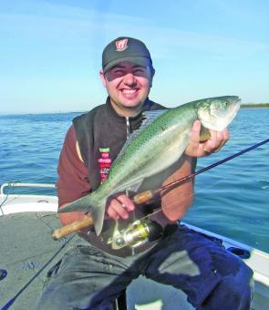 The Author holds up a nice salmon weighing 4.5lb caught on a Berkley power minnow.