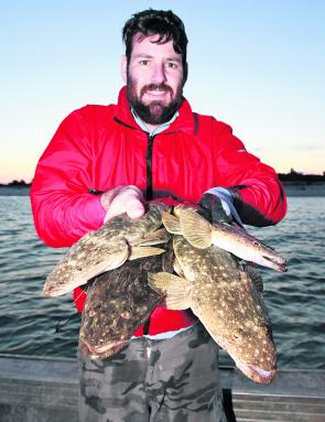 Colin King with his hands full of quality dusky flathead.