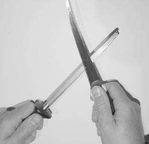 When using a sharpening steel, run the blade along its length at an acute angle.