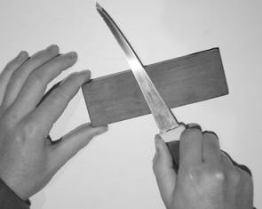 On a sharpening stone, work the blade in a circular motion.