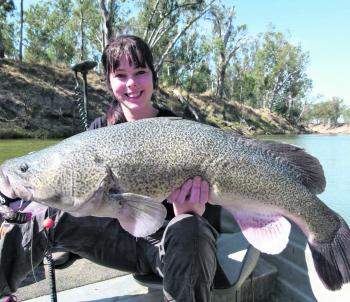 Ally Macklan with an 83cm Cod caught on a Balista Lure. 