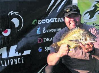 Peter Marshall from Team MPW displays the thumping 1.48kg Bream that handed him the JML Anglers Alliance Big Bream.