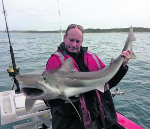 Paul Olden with a very nice size school shark caught out from Inverloch.