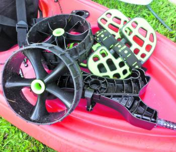 The C-Tug Kayak Trolley disassembles for storage in a kayak hatch.