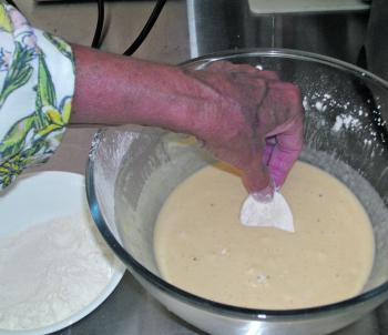 Dip each flour coated potato slice into the ginger beer batter. 