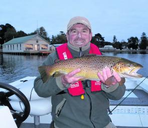 Fly fishing from the boat in Lake Wendouree can prove effective this time of year and here Craig Mitchell holds up a beautifully marked brown as proof. 