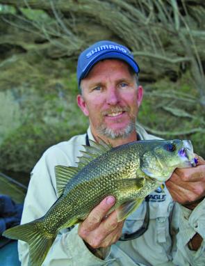 Slow moving jigs crawled across the bottom can tempt brown water bass checking out newly covered country. The keys are working the lure very slowly.