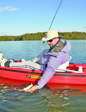 If you like wide open spaces all to yourself you will like flats fishing in a kayak. The author brings another shallow-water bream to hand.