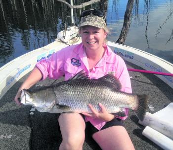 Kylie from NSW with an 85cm barra that she caught in winter.