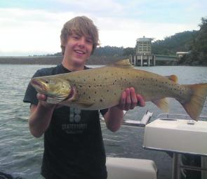 Damien Lucarelli with his whopping 70cm brown trout caught in Lake Eildon.