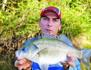 The author with a great fat bass taken on a surface lure.