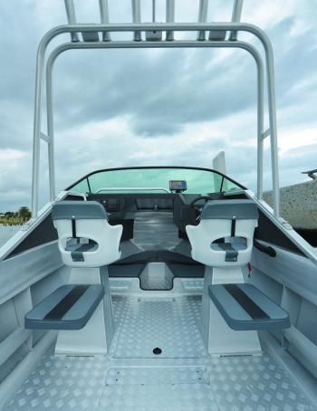 The targa top is a great place to store the excess rods while on the water. Note the interesting passenger seat set-up. They’ll be dry!
