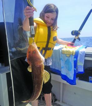 Lilly Phillips with a 54cm Southern Sand Flathead she caught off Low Head