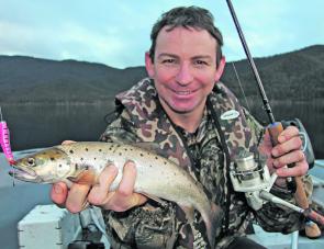 Sandy ‘Camo’ Hector with a brown trout caught at Lake Dartmouth on a pink Tassie Devil lure in winter 2012. Lake Dartmouth is the number 1 fishery in North East Victoria during the winter months.