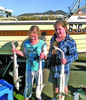 Bethany and Madeline Hourigan show off a great day’s catch of gummy sharks caught at Port Albert.