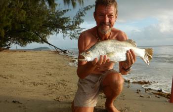 Local ‘Sharky’ Shane Down tapped into the rich supply of fish including this barra, along the Four Mile Beach when it fired up.