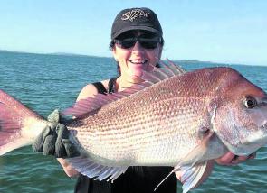 Amanda with a very nice snapper landed on a freshly caught squid presentation.