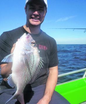 Mick with a snapper caught fishing in 65m off Coogee over broken reef.
